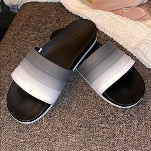 Gray and white slip on adidas